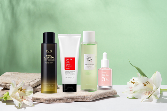 korean skincare products from cosrx, dr.g, anua and beauty of joseon on a green background