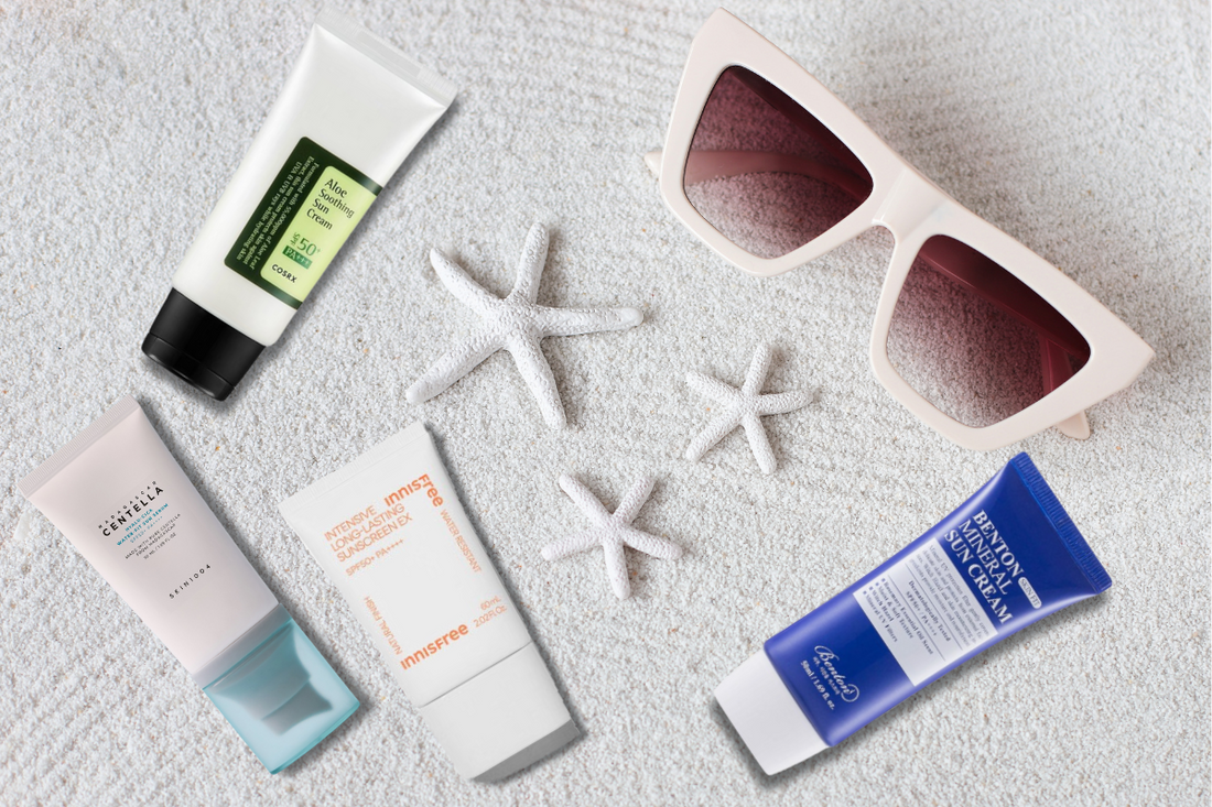 Cosrx, Benton, Innisfree and Skin1004 sunscreen on white sand backgroud