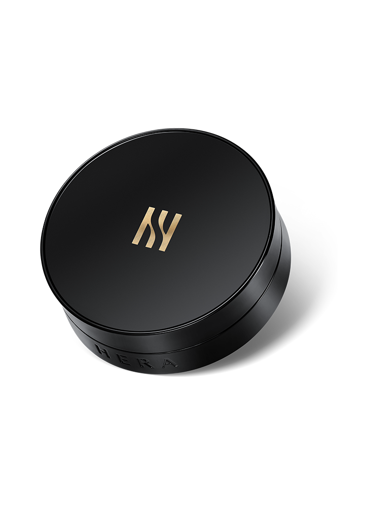 Black compact with a silver HERA logo containing two, 15 gram refills of ivory colored, SPF 34 PA++ cushion foundation.