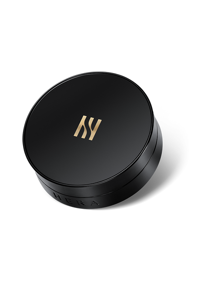 Black compact with a silver HERA logo containing two, 15 gram refills of ivory colored, SPF 34 PA++ cushion foundation.