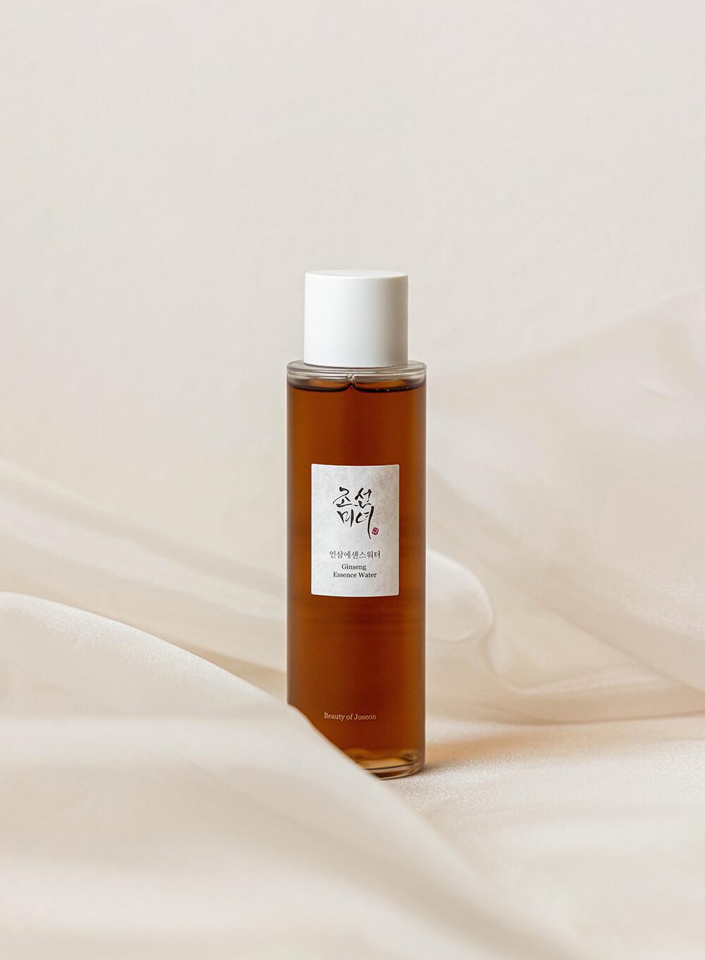 150ml bottle of Beauty of Joseon Ginseng Essence Water, a Korean skincare product with ginseng root extract, up against a flowy white background