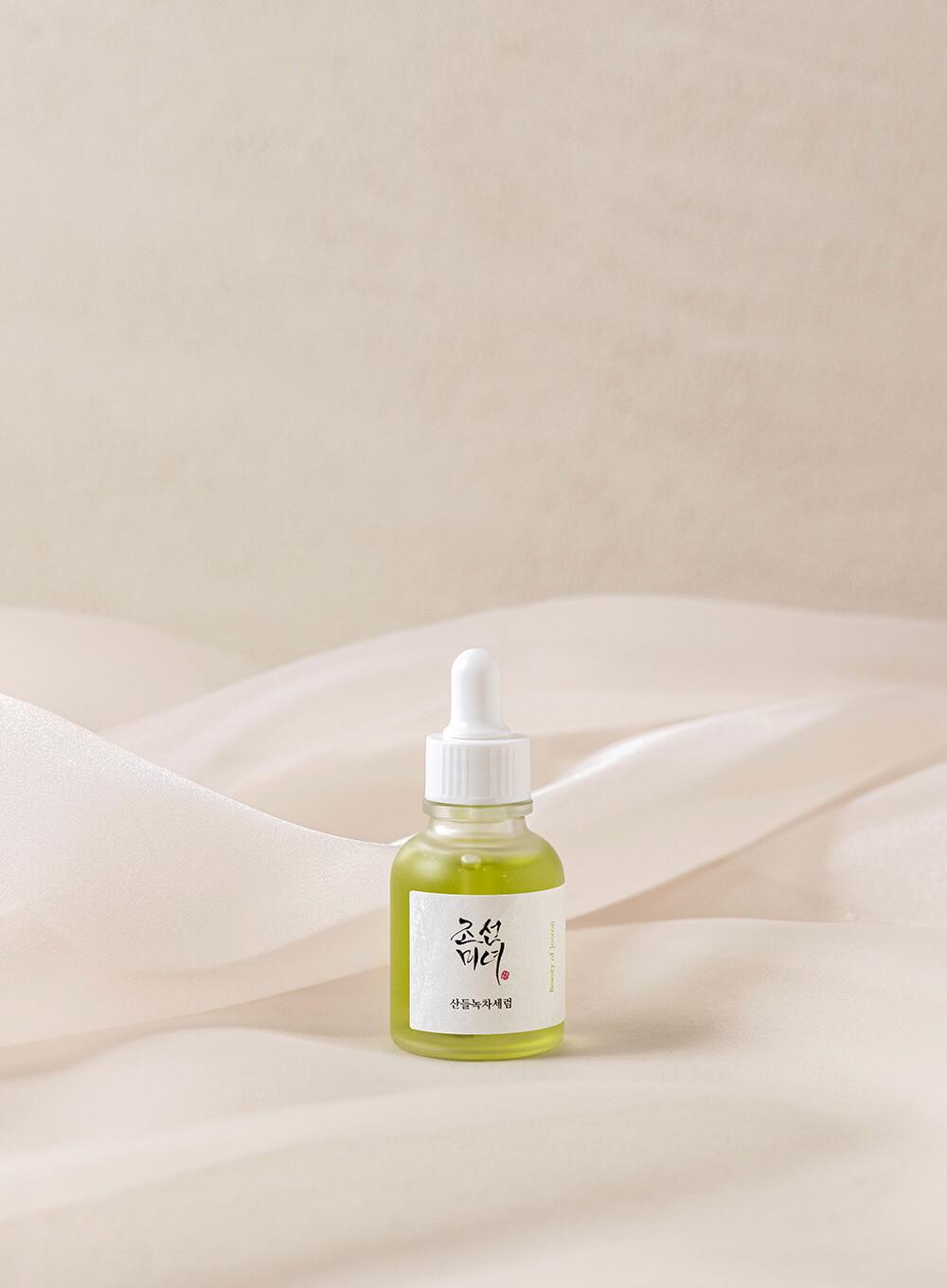 Beauty of Joseon Calming Serum, a lightweight, green tea-based serum for hydrating and soothing irritated skin. Serum is in a small bottle against a flowy white background