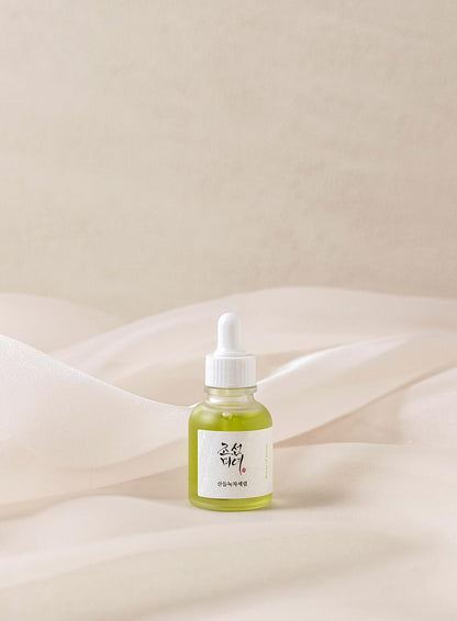 Beauty of Joseon Calming Serum, a lightweight, green tea-based serum for hydrating and soothing irritated skin. Serum is in a small bottle against a flowy white background