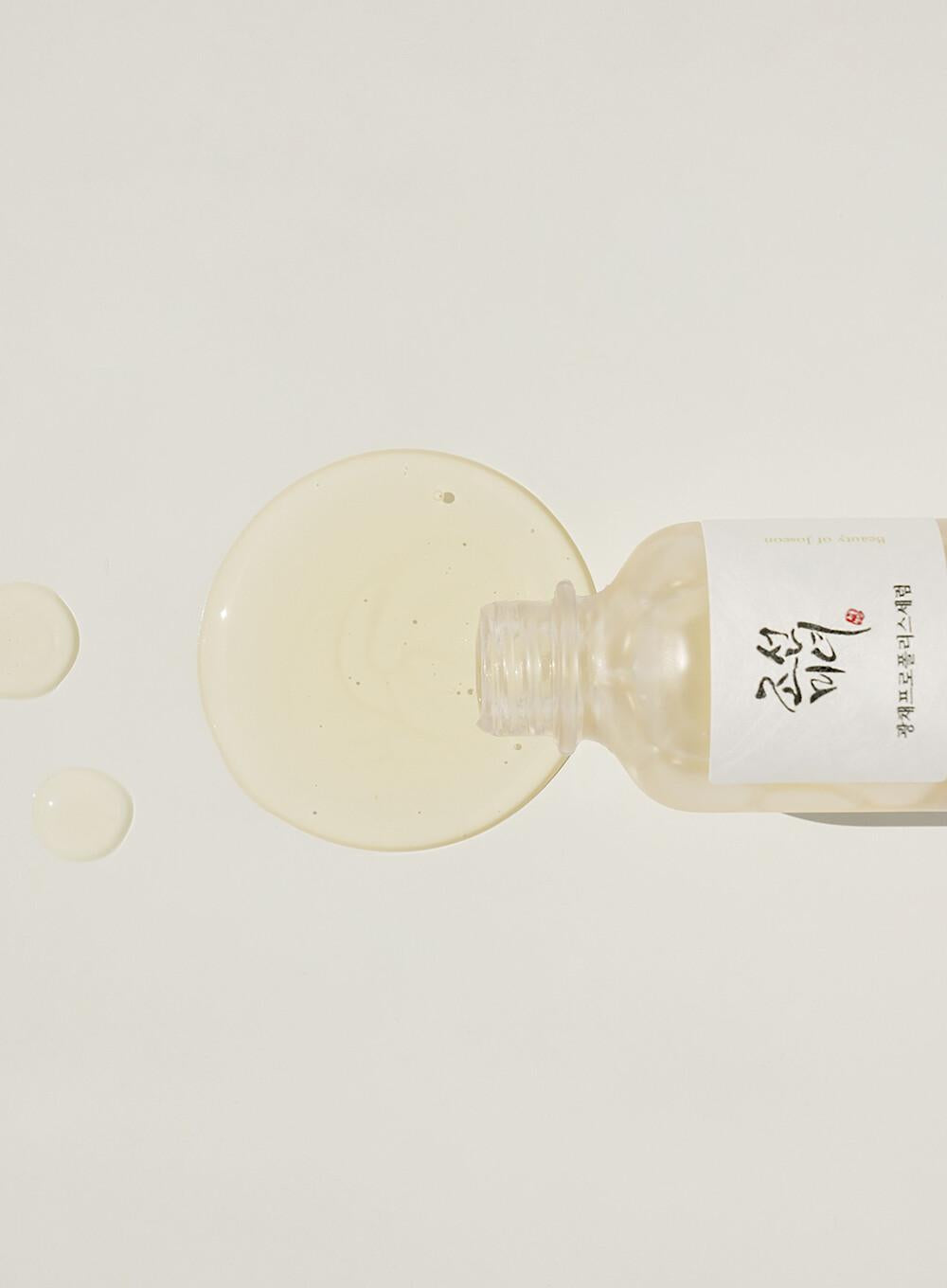 30ml bottle of Beauty of Joseon Glow Serum, a Korean skincare serum with propolis and niacinamide for radiant and balanced skin up against a white flowy backdrop