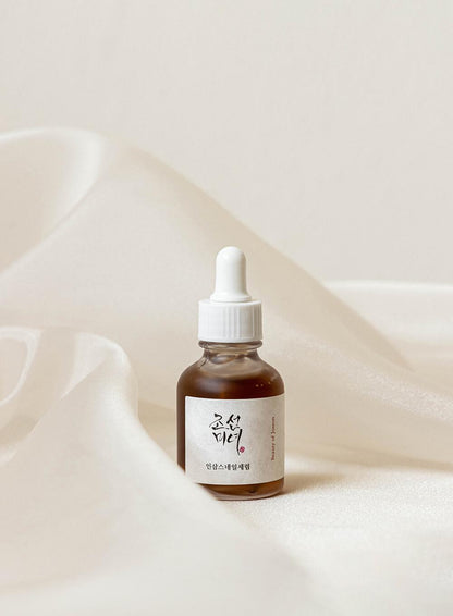 30ml Luxurious, silky Beauty Of Joseon Revive Serum with ginseng and snail mucin against a white flowy background