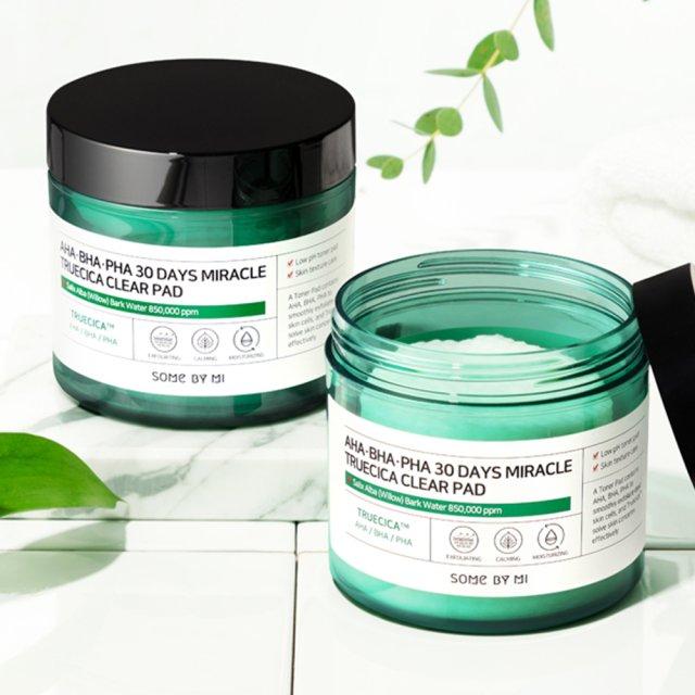 Some By Mi AHA, BHA, PHA 30 Days Miracle Truecica Clear Pad in a 70-count container. These pre-soaked cotton pads contain a blend of alpha hydroxy acids (AHAs), beta hydroxy acids (BHAs), and polyhydroxy acids (PHAs) to gently exfoliate dead skin cells, unclog pores, and promote skin renewal.  pen_spark