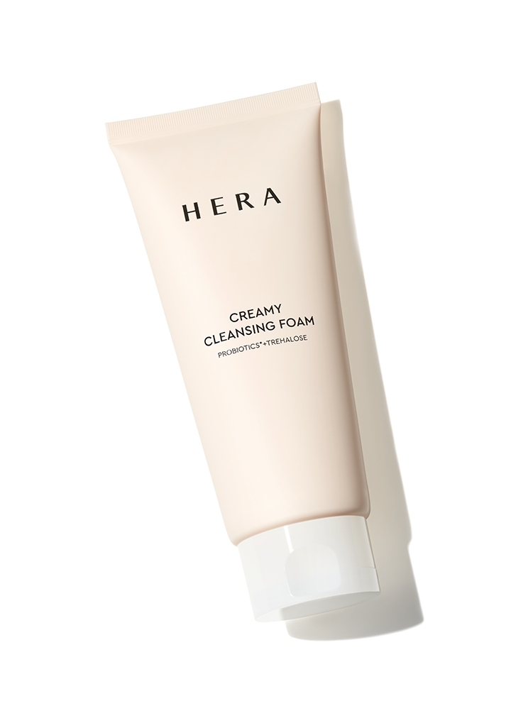 A white tube of Hera Creamy Cleansing Foam, a 200g facial cleanser.