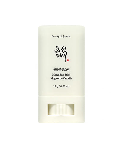 Travel-friendly, 18g stick sunscreen by Beauty of Joseon with mugwort and camellia for shine control and SPF protection against a white backdrop