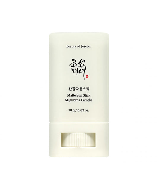 Travel-friendly, 18g stick sunscreen by Beauty of Joseon with mugwort and camellia for shine control and SPF protection against a white backdrop