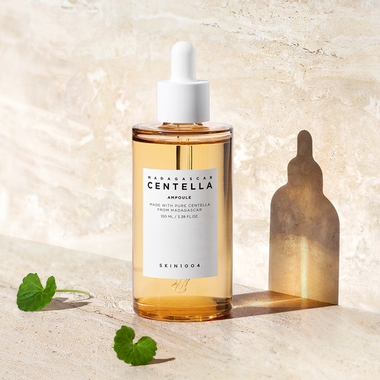 Clear glass bottle with dropper containing Skin1004 Madagascar Centella Ampoule, a lightweight ampoule for all skin types to hydrate and strengthen the skin barrier.