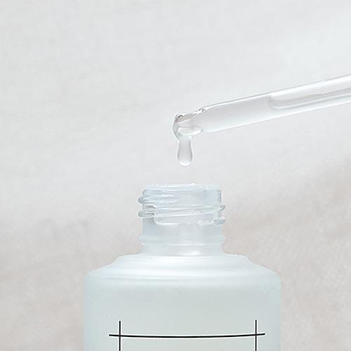 Clear bottle with dropper applicator for Numbuzin No. 3 Skin Softening Serum, formulated to address uneven texture and enlarged pores.