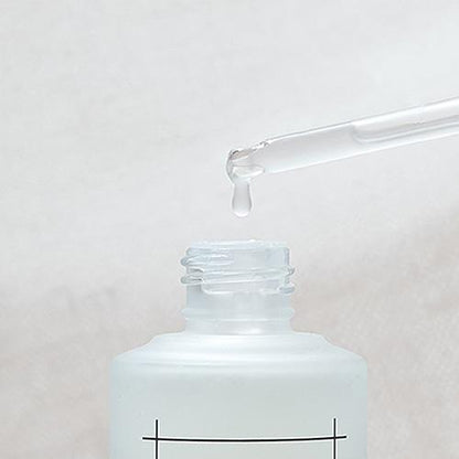 Clear bottle with dropper applicator for Numbuzin No. 3 Skin Softening Serum, formulated to address uneven texture and enlarged pores.