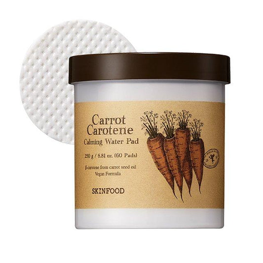 Skinfood Carrot Carotene Calming Water Pads in a 250g tub, containing 60 vegan and cruelty-free cotton pads soaked in a calming essence with carrot extract for redness relief and hydration on sensitive skin.