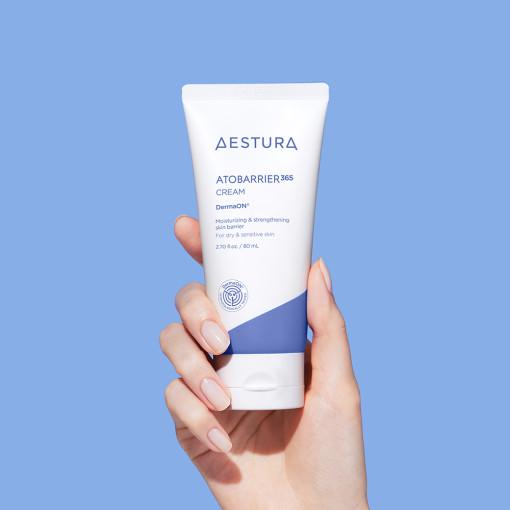 A white tube of Aestura Atobarrier 365 Cream, a lightweight, deeply moisturizing facial cream formulated to strengthen the skin's moisture barrier and prevent dryness. This 80ml tube contains visible encapsulated beads for long-lasting hydration.