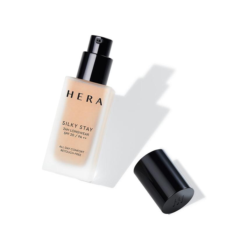 A bottle of Hera Silky Stay Foundation in shade 13N1 Porcelain. It is a liquid foundation with a silky texture, offering 24-hour longwear and PA++ sun protection.