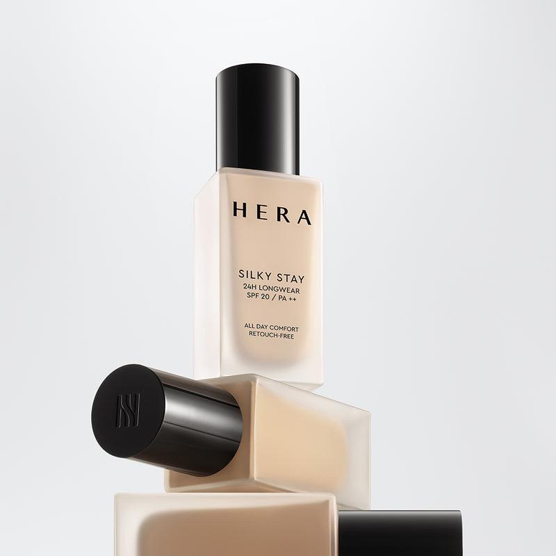 A bottle of Hera Silky Stay Foundation in shade 13N1 Porcelain. It is a liquid foundation with a silky texture, offering 24-hour longwear and PA++ sun protection.