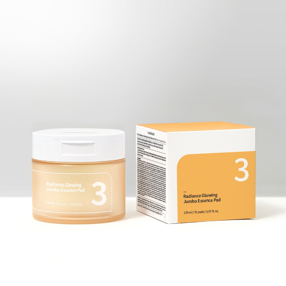 A jar of Numbuzin No. 3 Radiance Glowing Jumbo Essence Pads, containing 70 pre-soaked pads in 150ml of essence for brightening and hydrating skin.