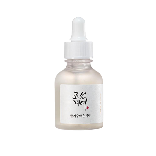 30ml bottle of Beauty of Joseon Glow Deep Serum, a Korean Hanbang (traditional herbal medicine) serum with rice and alpha arbutin for a radiant complexion up against a white flowy backdrop