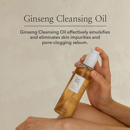 210ml bottle of Beauty of Joseon Ginseng Cleansing Oil, a Korean skincare oil cleanser for dissolving makeup and impurities against a white flowy backdrop