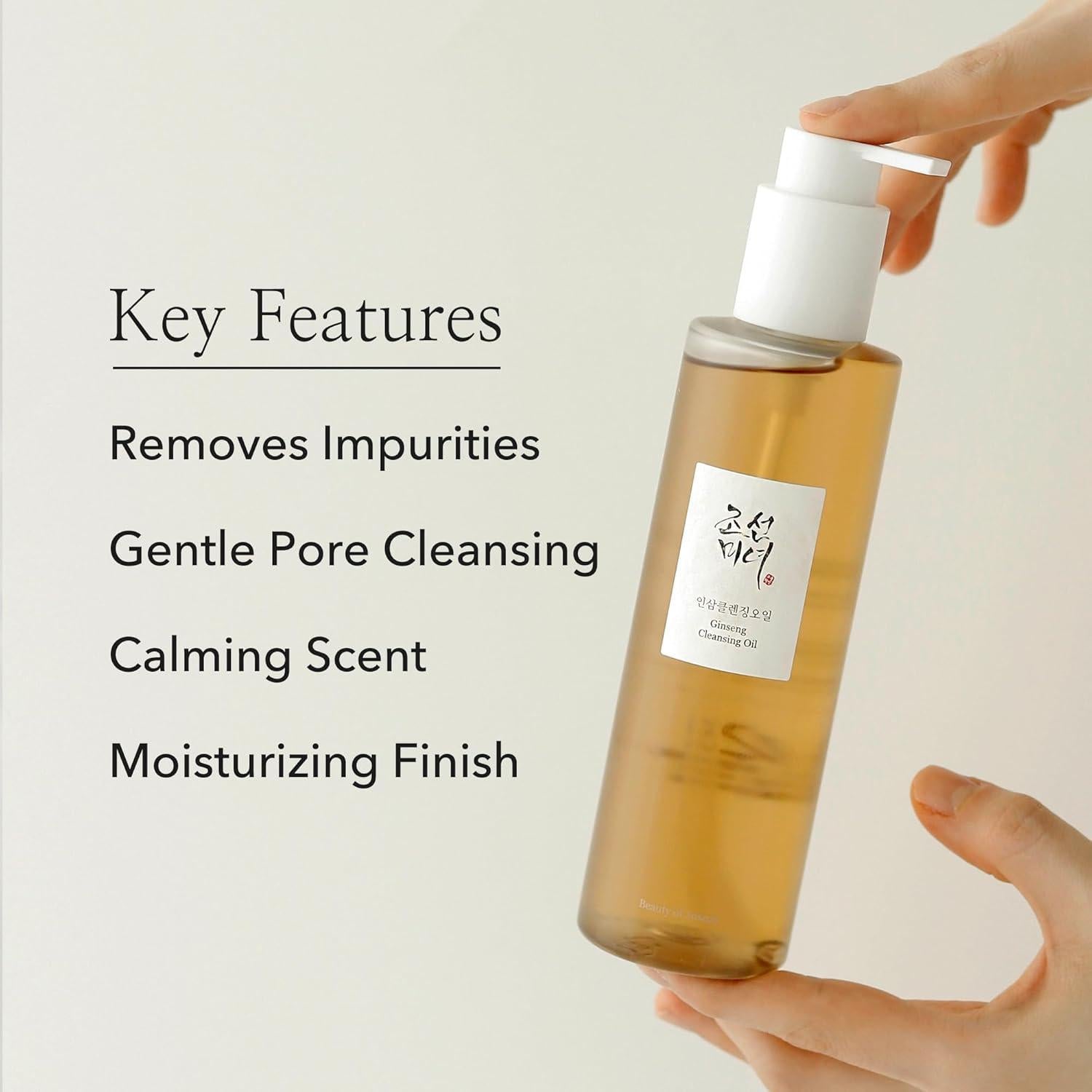 210ml bottle of Beauty of Joseon Ginseng Cleansing Oil, a Korean skincare oil cleanser for dissolving makeup and impurities against a white flowy backdrop