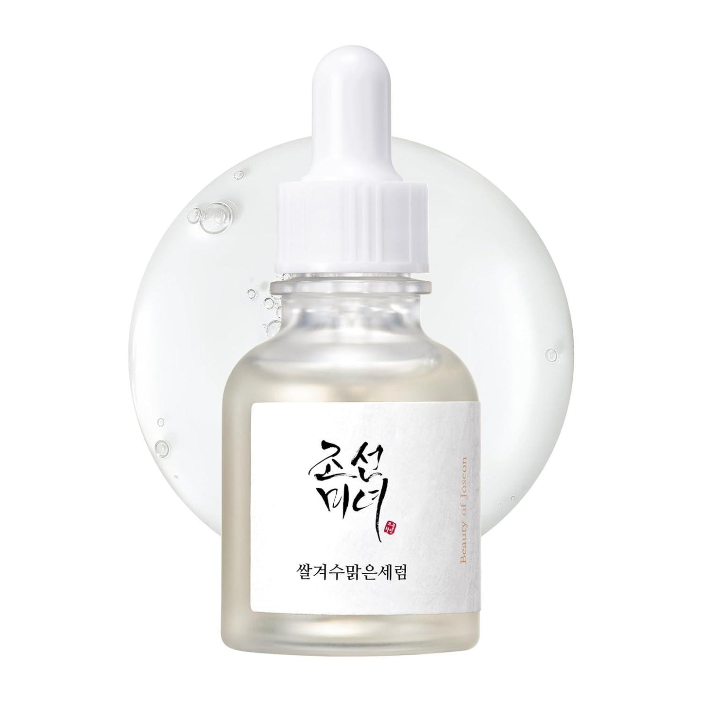 30ml bottle of Beauty of Joseon Glow Deep Serum, a Korean Hanbang (traditional herbal medicine) serum with rice and alpha arbutin for a radiant complexion up against a white flowy backdrop