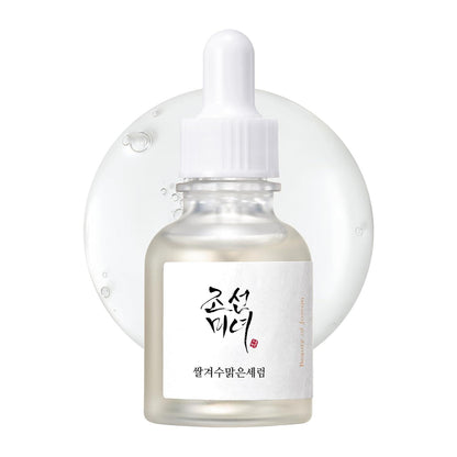 30ml bottle of Beauty of Joseon Glow Deep Serum, a Korean Hanbang (traditional herbal medicine) serum with rice and alpha arbutin for a radiant complexion up against a white flowy backdrop