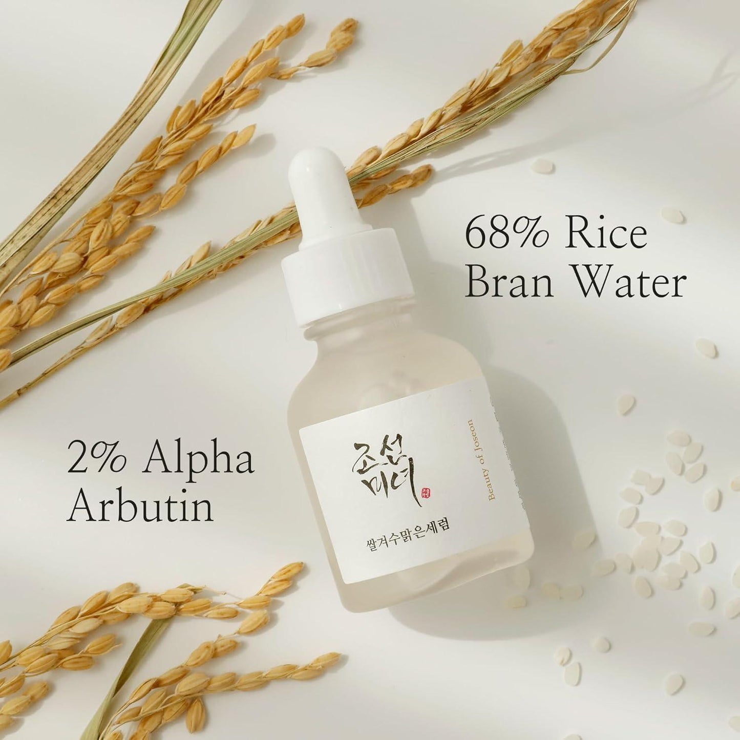 30ml bottle of Beauty of Joseon Glow Deep Serum, a Korean Hanbang (traditional herbal medicine) serum with rice and alpha arbutin for a radiant complexion up against a white flowy backdrop