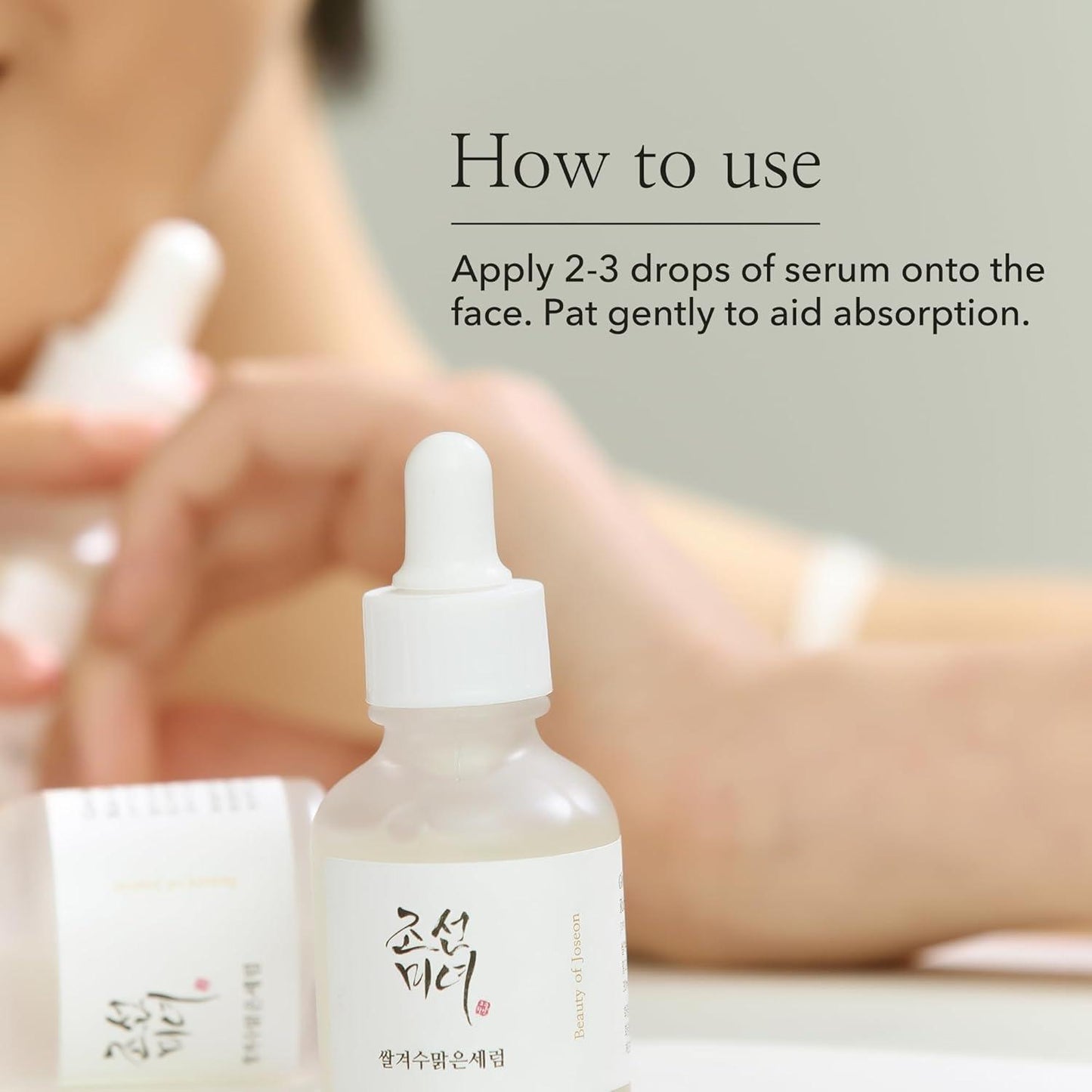 30ml bottle of Beauty of Joseon Glow Deep Serum, a Korean Hanbang (traditional herbal medicine) serum with rice and alpha arbutin for a radiant complexion up against a white flowy backdrop