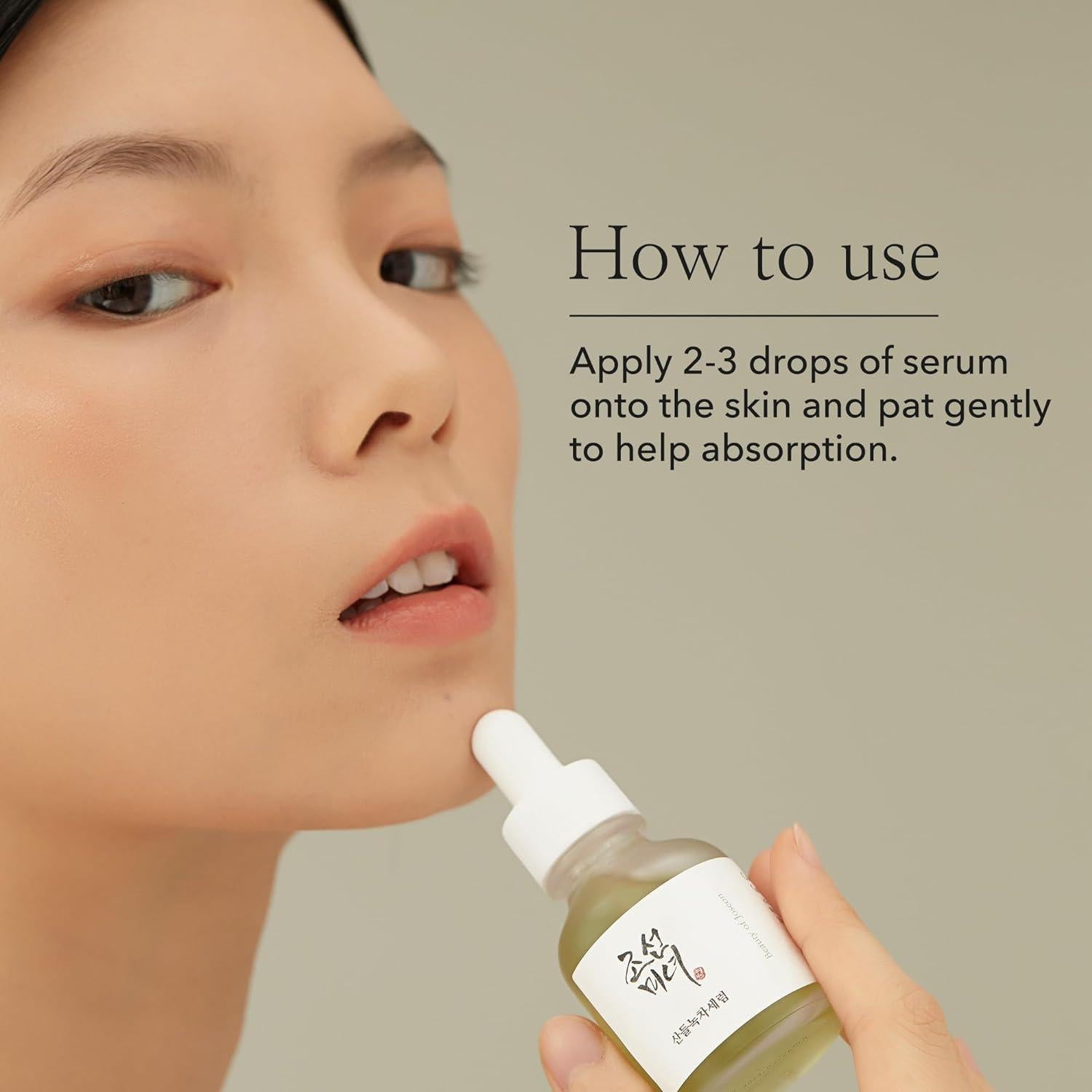 Beauty of Joseon Calming Serum, a lightweight, green tea-based serum for hydrating and soothing irritated skin. Serum is in a small bottle against a flowy white background