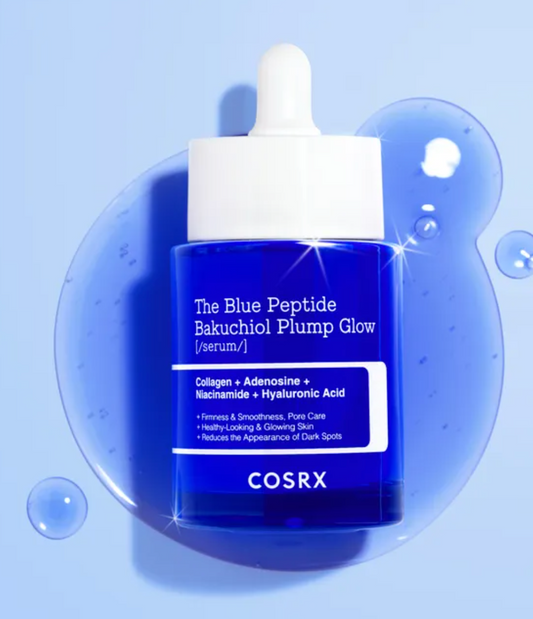 COSRX The Blue Peptide Bakuchiol Plump Glow serum in a deep blue bottle with a white dropper cap, set against a light blue background with a translucent blue liquid splash and bubble graphic.