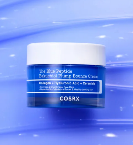 COSRX The Blue Peptide Bakuchiol Plump Bounce Cream jar, a blue and white cosmetic container, centered against a textured blue background.