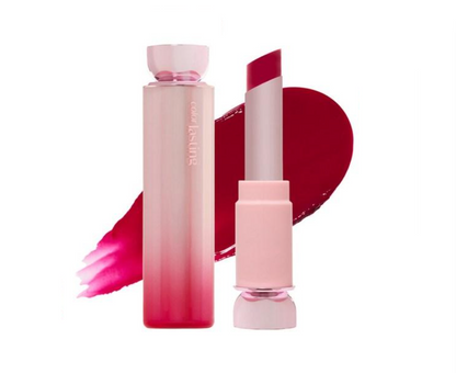 A pink cosmetic tube and matching lipstick bullet with a deep red-pink product shade, shown on a white background with a matching red-pink product swatch behind it. The brand name 'cosé mi luna' is visible on the tube.
