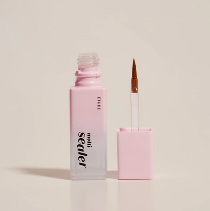 A bottle of ETUDE Sealer liquid with a pink-to-clear gradient and a separate applicator brush with a pink cap, set against a solid light beige background.