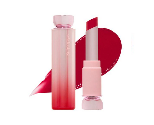 A cosmetic lipstick and matching bottle set on a white background, with a large red lipstick smear behind them. The bottle is pale pink at the top and fades into a deeper red at the bottom, and the lipstick bullet is shown upright with a matching red tip.