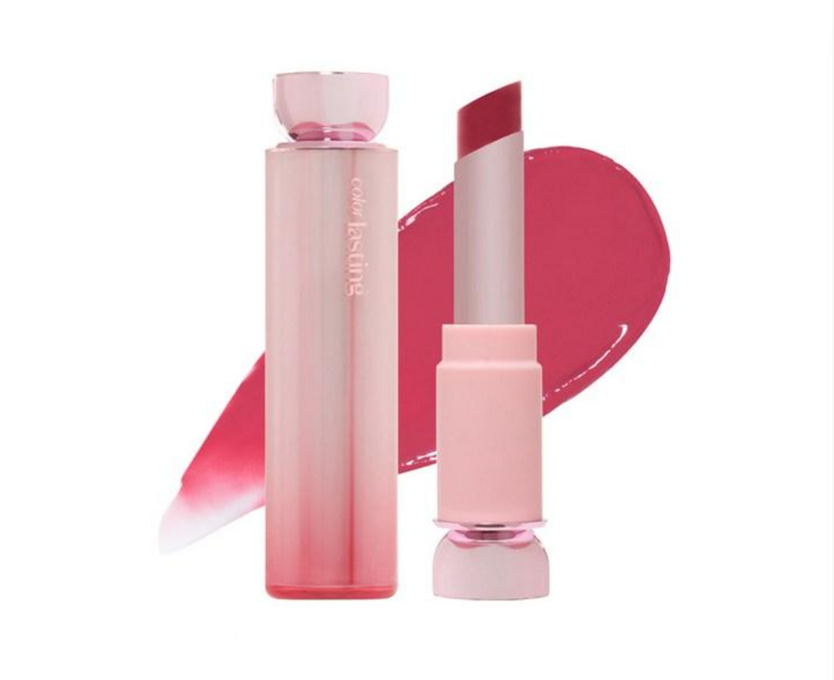 A pink cosmetic lipstick shown with its cap on and cap off, alongside a pink product smear on a white background. The brand name 'color by Leslie' is visible on the tube.