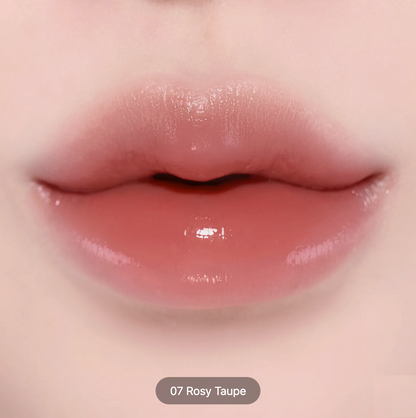 Close-up of glossy lips wearing a rosy taupe lip color, with a small label at the bottom reading '07 Rosy Taupe'.