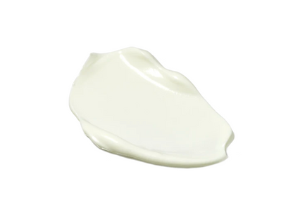 A dollop of thick, creamy off-white cosmetic product, shown on a solid white background.