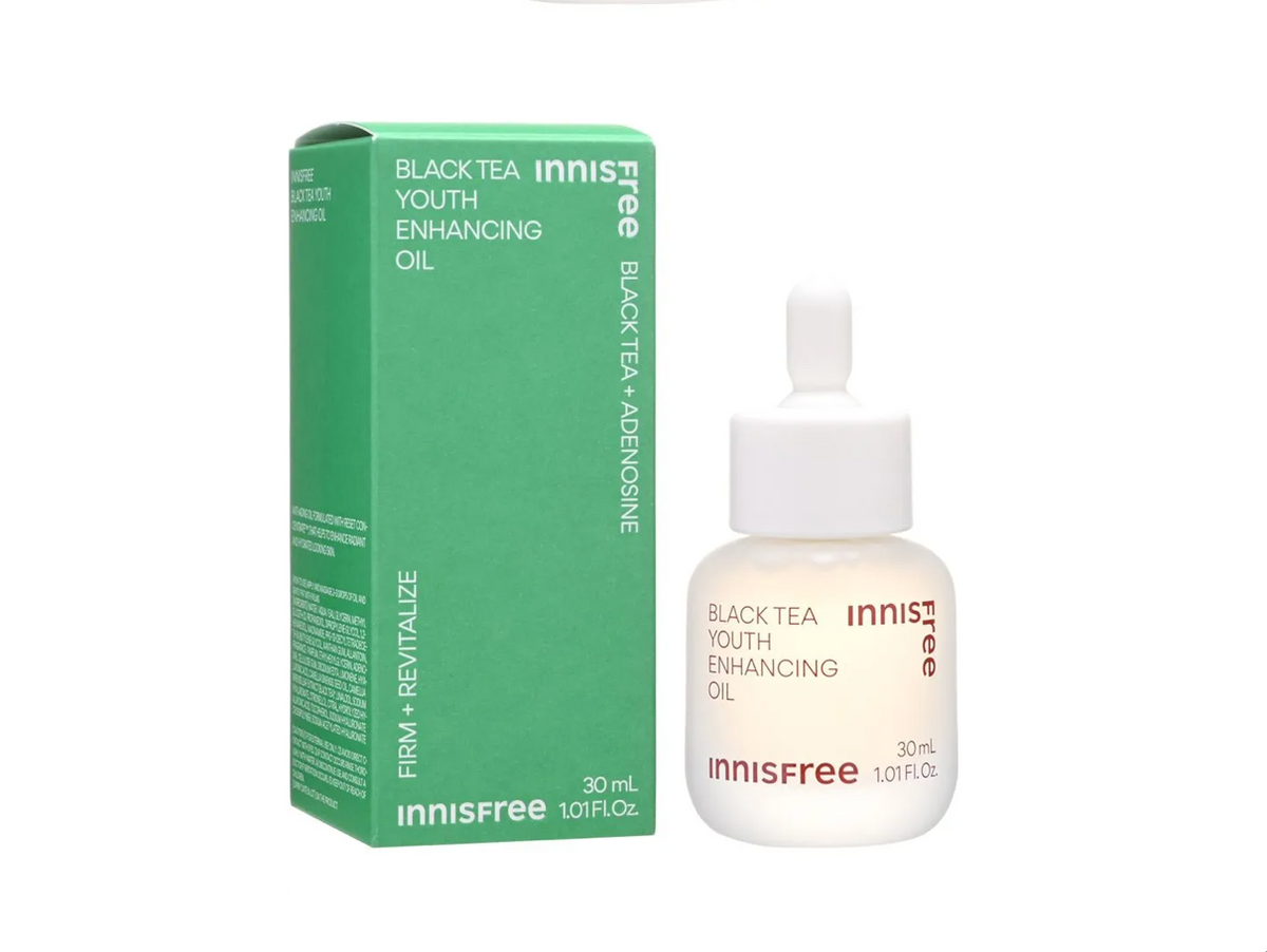 Innisfree Black Tea Youth Enhancing Oil shown with its green product box and a white dropper bottle on a plain white background.