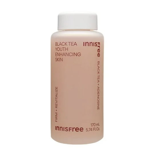 An Innisfree skincare bottle containing Black Tea Youth Enhancing Skin serum, featuring a pale peach-pink liquid and a white cap on a clean white background.