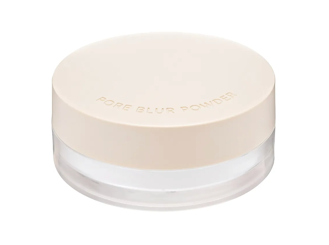 A jar of Pore Blur Powder with a light beige lid and a clear container showing the white powder inside, set against a plain white background.