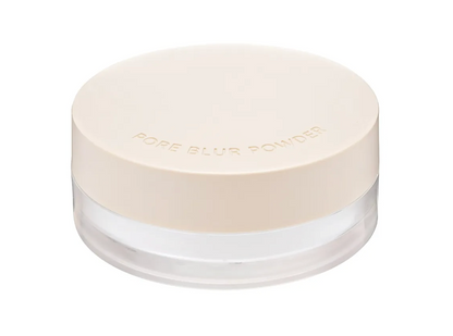 A jar of Pore Blur Powder with a light beige lid and a clear container showing the white powder inside, set against a plain white background.
