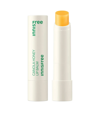 Innisfree Canola Honey Lip Balm shown with the cap off, displaying the bright yellow-orange balm stick next to its white and green labeled tube on a clean white background.