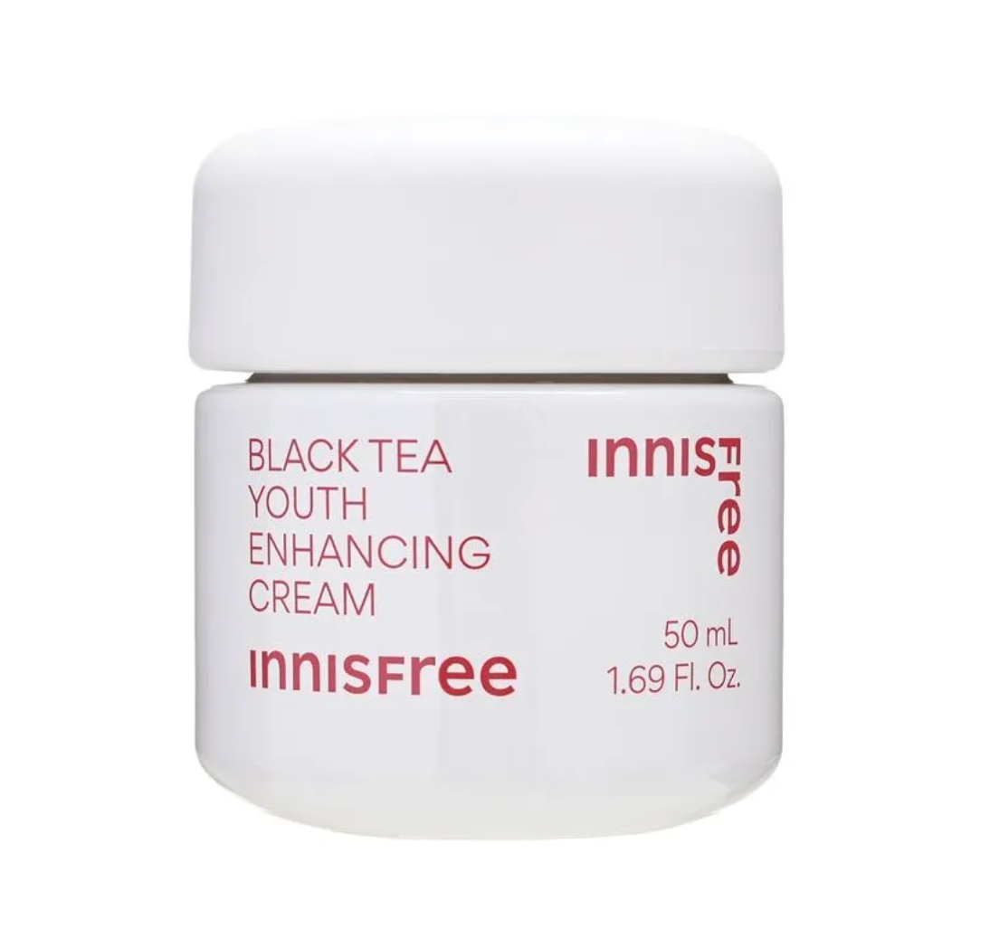 A white jar of Innisfree Black Tea Youth Enhancing Cream with red text on a clean white background.