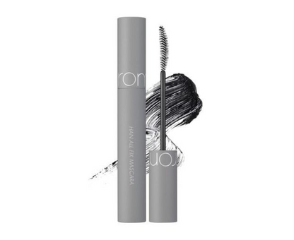 A gray tube of Ronka Hair All In One Mascara shown next to its applicator wand, with a black mascara smear graphic behind them on a white background.