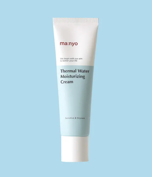 A single tube of ma:nyo Thermal Water Moisturizing Cream centered on a solid light blue background. The tube is white with a pale blue lower section and features the brand name 'ma:nyo' in red and the product name in black text.