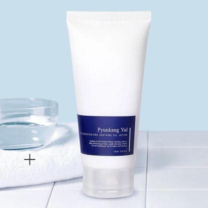 Tube of Pyunkang Yul lotion on a light blue background