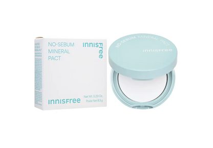 Innisfree No-Sebum Mineral Pact powder compact in a light pastel blue-green shade, shown open next to its white and blue packaging box on a clean white background.