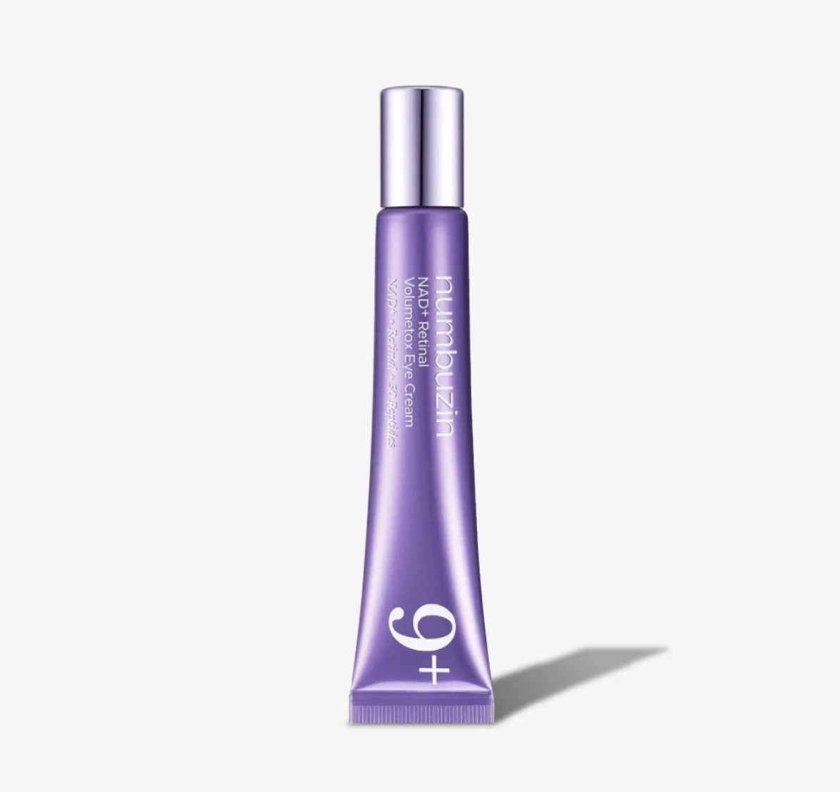 A lavender purple squeeze tube of +9 Parabelz Vitamin Eye Cream with a metallic silver cap, set against a clean off-white background with a soft shadow.
